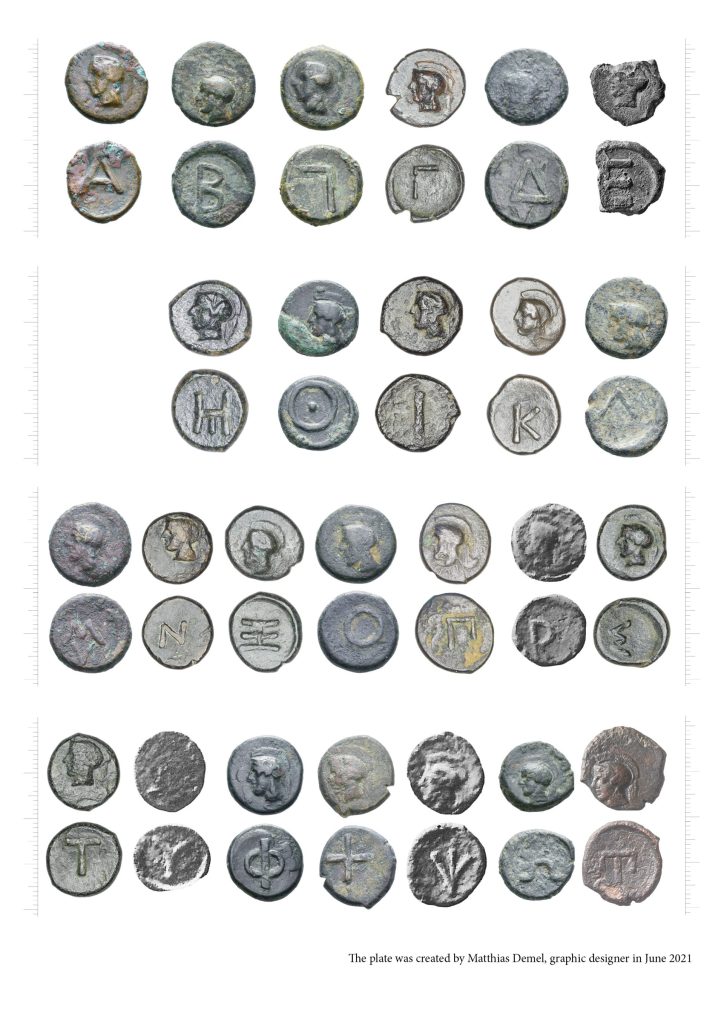Comparative plate showing numerous ancient metal tokens with different symbols and inscriptions, arranged in rows for typological study.