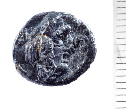 Ancient coin with face detail