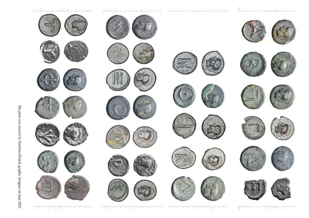 Ancient coins arranged in rows