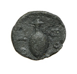 Worn ancient metal token with indistinct imagery and uneven edges.